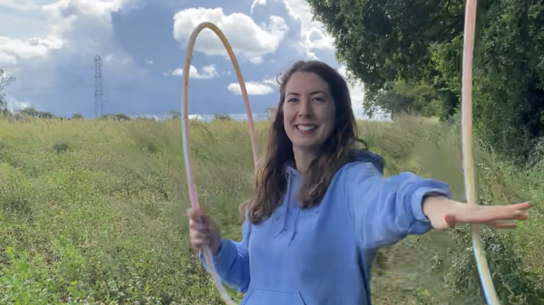 Amy Hula Hooping in a field