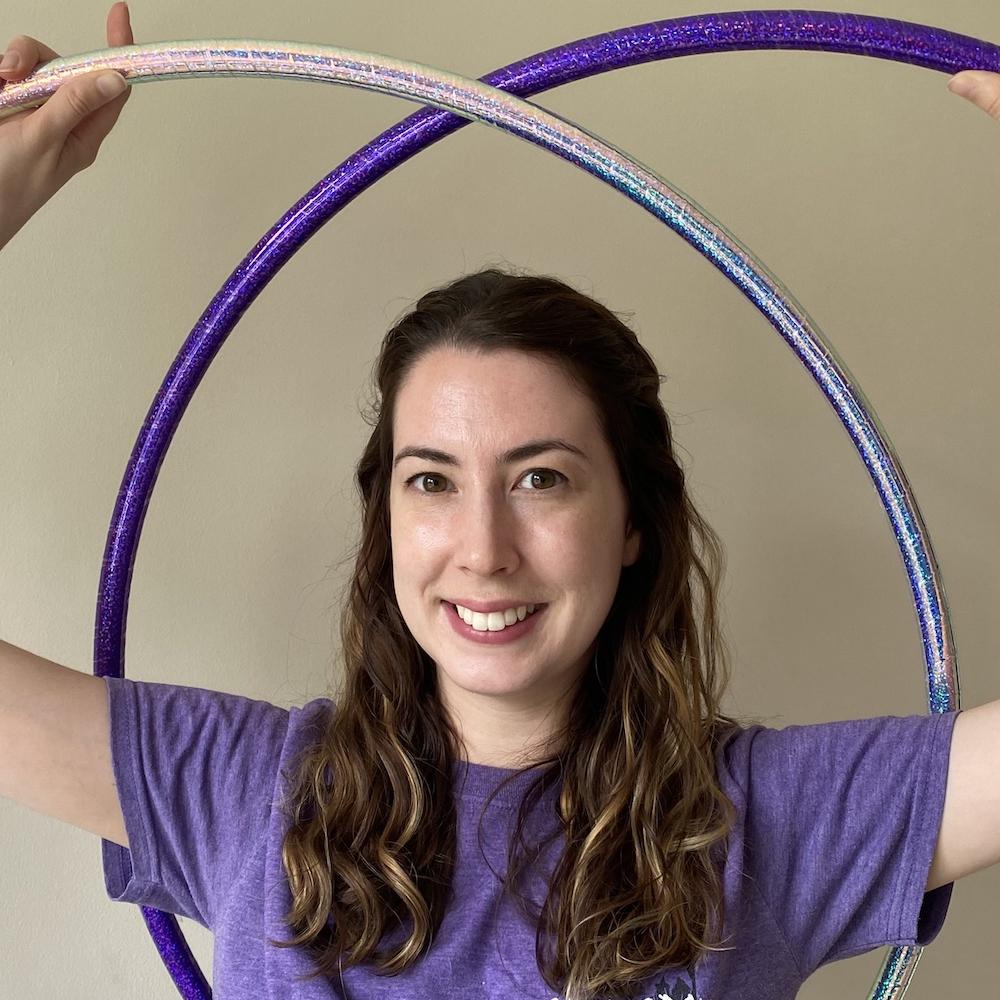 Amy holding to hula hoops.